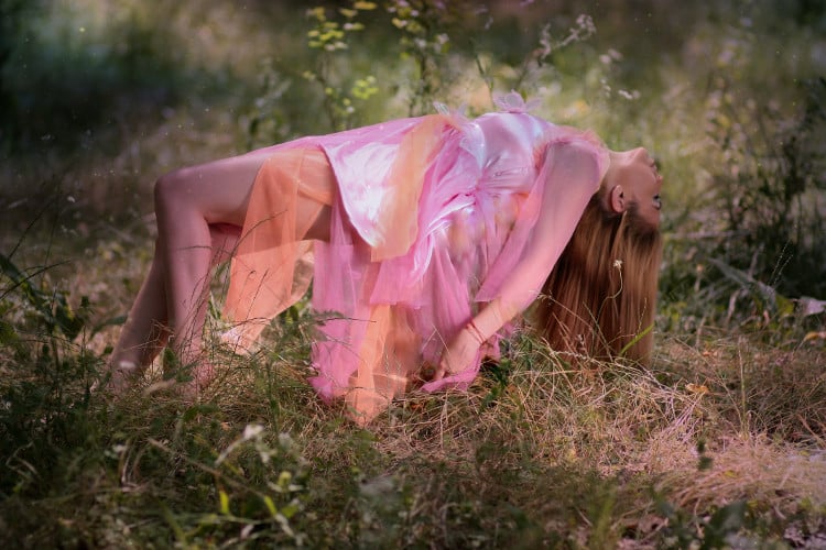 Hypnotized woman floating above the ground