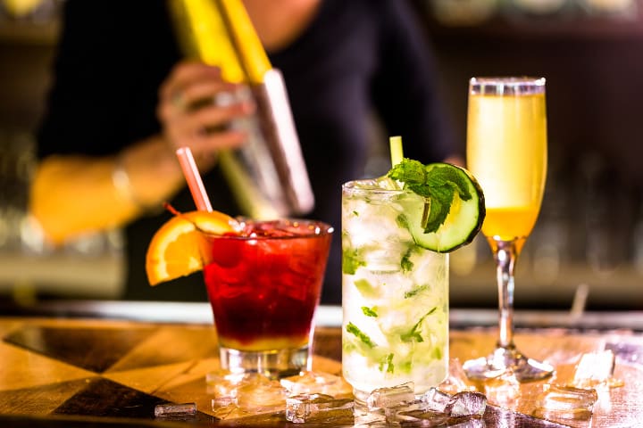 Bartender crafting mixed drinks