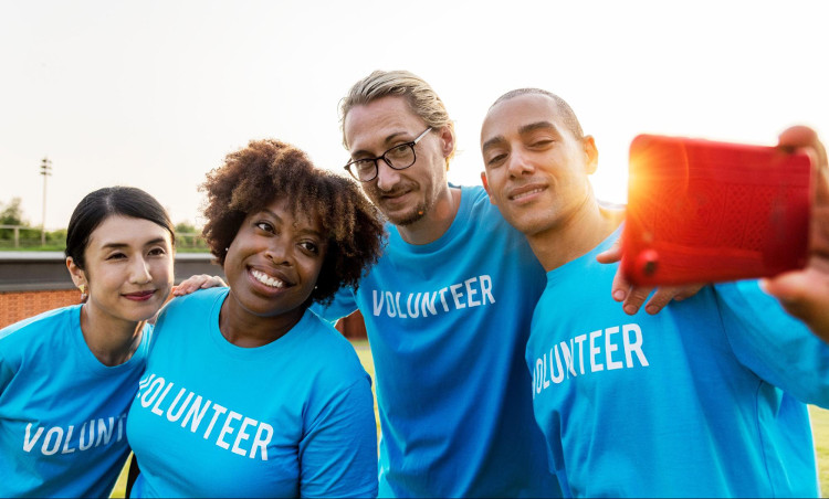 Diverse group of volunteers taking a selfie
